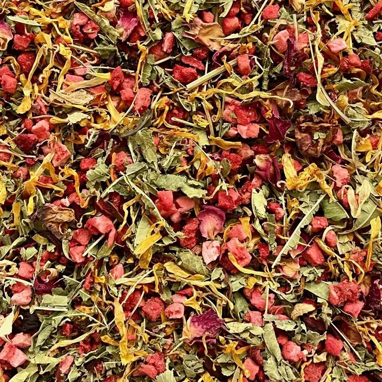 Close up view of loose strawberry and lemon verbena summer seasonal tisane, showing ingredients.