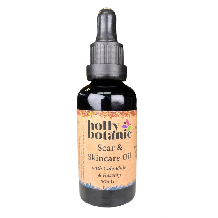 A scar and skincare oil made with plant extracts and oils supplied in a recyclable blue glass dropper bottle.