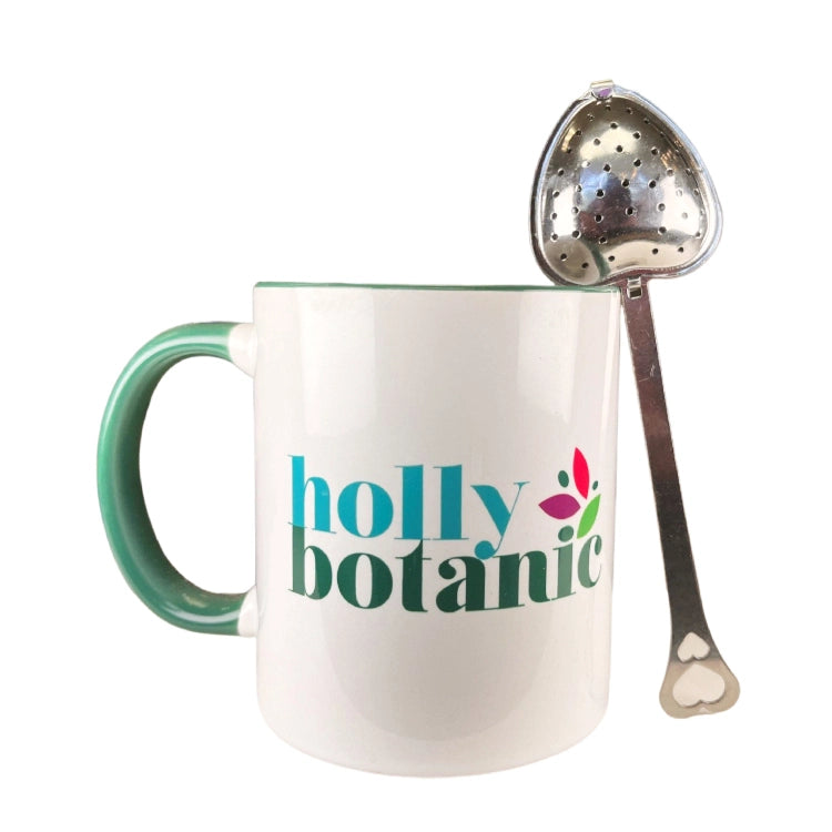 Stainless steel heart tea or tisane infuser designed for use with loose tea. with Holly Botanic mug