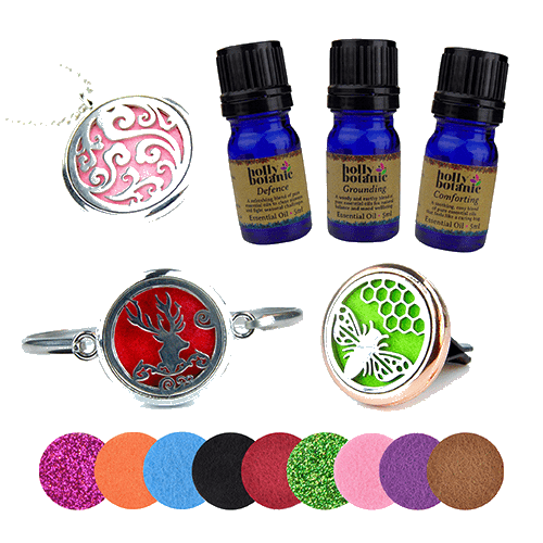 Essential oil blend bundle, including three blends, a bracelet infuser, a necklace infuser and a clip-on car diffuser with spare felt pads. 