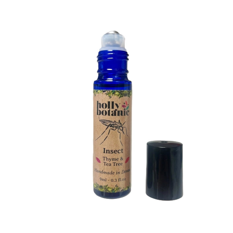 Insect roll-on oil in 9ml blue glass bottle with paper label, lid off