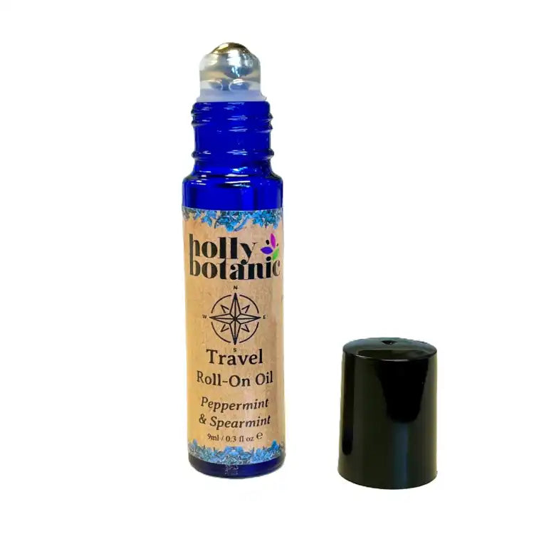 a blend of essential oils in a rollball bottle designed to ease travel worries and motion sickness. Lid Off