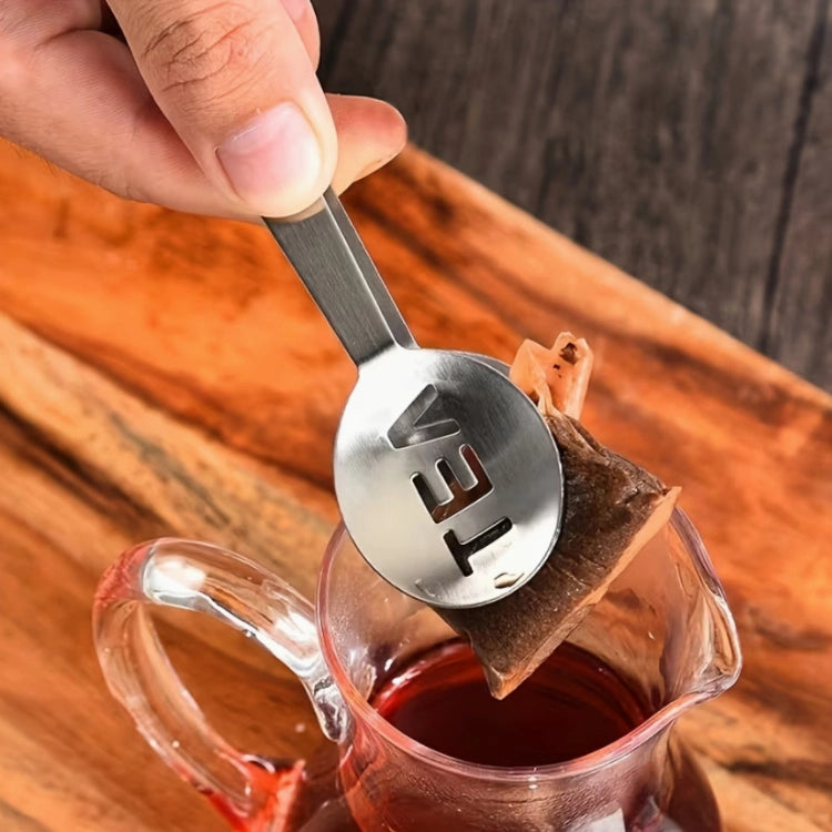 Stainless steel tea bag squeezer - in use